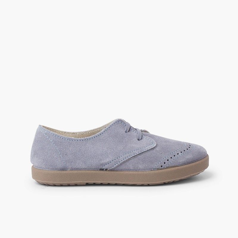 Derbies en suède avec motifs piqués sur le bout